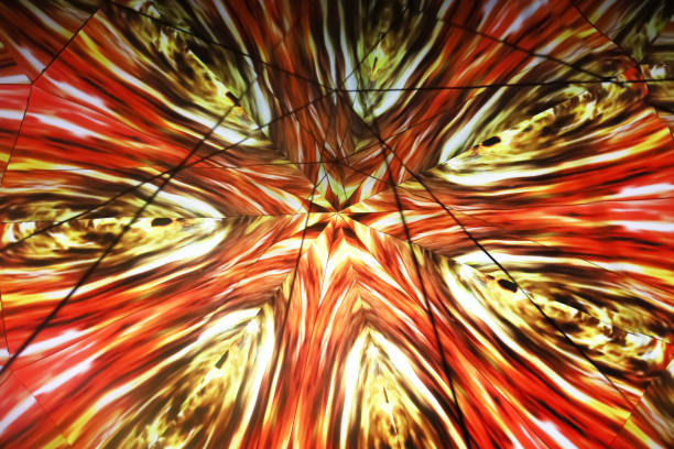 istock Bright orange repeating ornament. Carousel kaleidoscope. Glowing kaleidoscope pattern. Blurred image. low key 1419719502