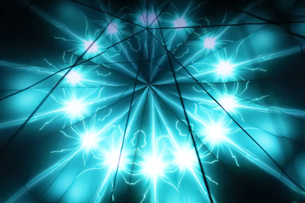 Turquoise neon star rays on dark background. Blurred image