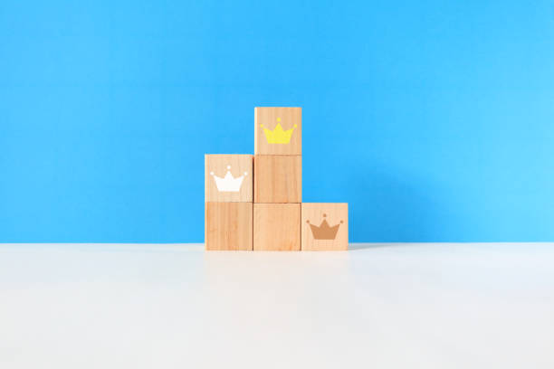 Gold, silver and bronze crowns on the podium.