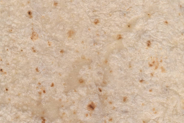 istock Tortilla mexican food texture in white background. Wrap texture 1419726606