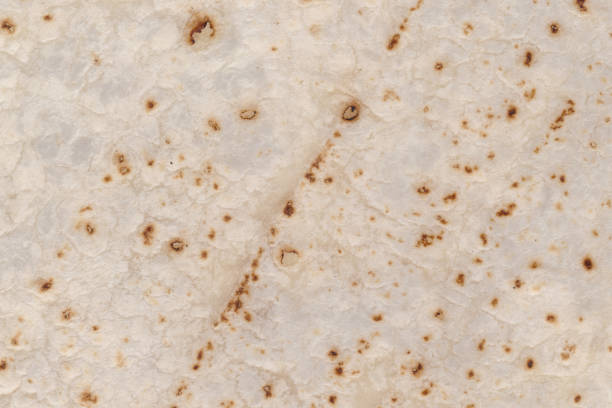 istock Tortilla mexican food texture in white background. Wrap texture 1419726615
