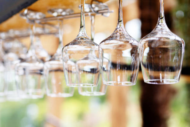 Upside down wine glasses hanging on the counter in the bar