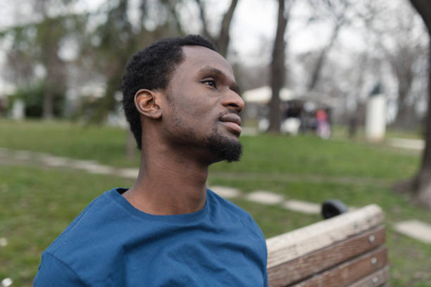 istock African American young man relaxing in the park 1419731651