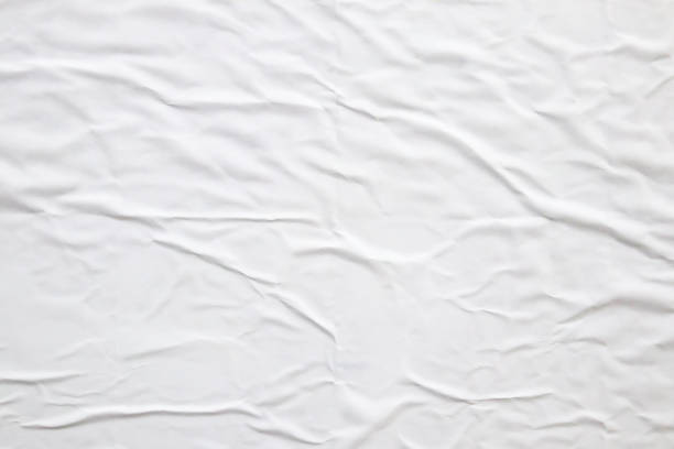 istock white crumpled and creased paper poster texture background 1419731796