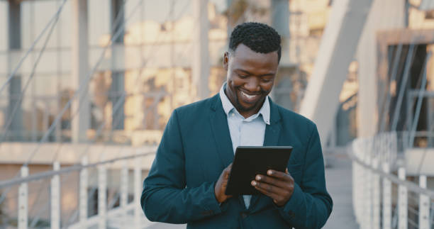 istock Business man working on 5g digital tablet in city, typing email on technology and reading communication on internet in town. Happy corporate professional sending text message and networking online 1419733569