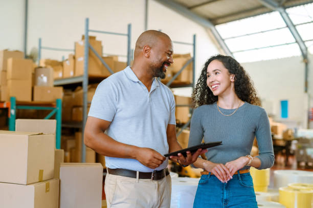istock Logistics, supply chain and ecommerce with a warehouse manager and courier working in a factory or plant. Delivery, stock and shipping with workers in the export of freight and cargo industry 1419741113