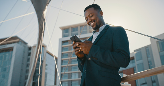Mobile or 5g network using businessman on phone smiling, texting and talking to WhatsApp message or emails. Happy corporate man chatting or reading messages on a smartphone outdoors from work