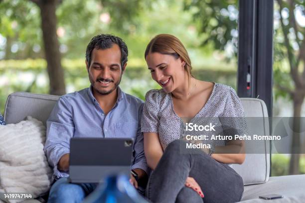 Couple Interacting With Social Media Partners Stock Photo - Download Image Now