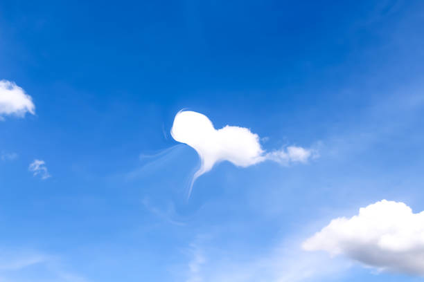 istock Clouds in white heart shape design on vast bright bluesky love summer  background 1419752477