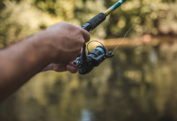 istock Unrecognizable fisherman angling on the river 1419752712