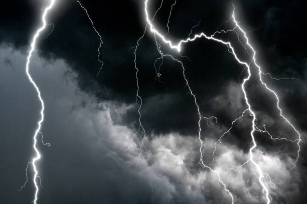 istock Dark cloud at evening sky with thunder bolt. Heavy storm bringing thunder, lightnings and rain in summer. 1419759292