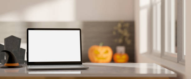 istock close-up, Modern workspace in Halloween theme with laptop mockup and copy space on tabletop 1419765702