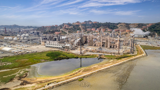 High quality aerial stock photo of a refinery and the Wildcat Marsh in Richmond, CA