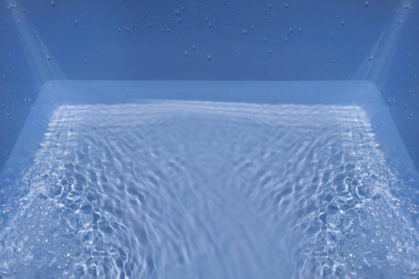 istock Defocus blurred transparent blue colored clear calm water surface texture with splashes and bubble. Trendy abstract nature background. Water wave in sunlight with copy space. Blue watercolor shining. 1419775891