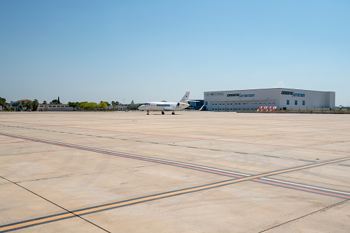Valencia Spain- June 20, 2018: White reactive private jets, parked on apron. Parked until next flight, waiting for the passengers.