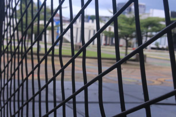 istock the camera is focused on the iron fence with a beautiful pattern 1419782328