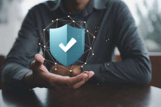 istock Businessman holding 3D digital shield protection with tick check mark on hand 1419782998