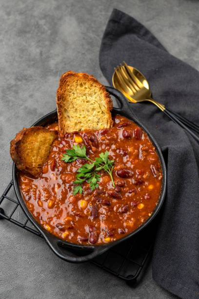istock Bean and corn soup or ragout, red bean stew on a wooden background. 1419784257