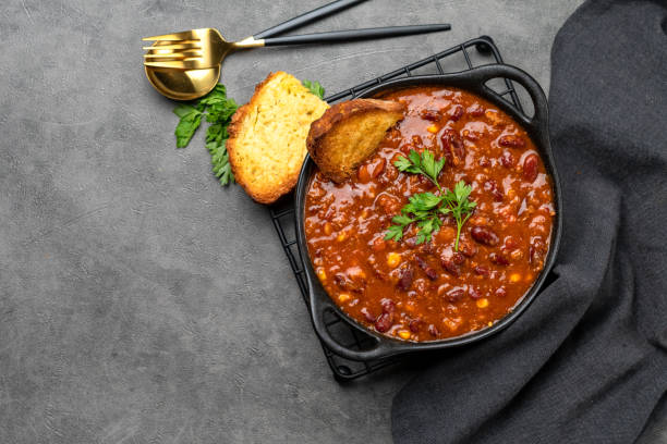 istock Bean and corn soup or ragout, red bean stew on a wooden background. 1419784302