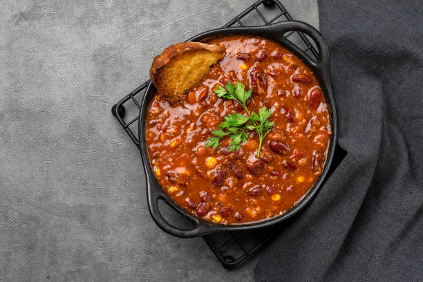 istock Bean and corn soup or ragout, red bean stew on a wooden background. 1419785036