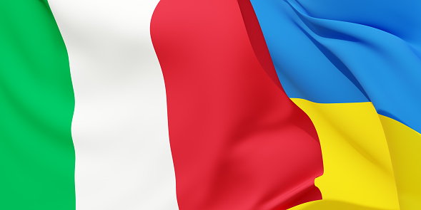 Italian and Ukrainian flags flying in the wind. Italy stand with Ukraine. 3D rendered image.