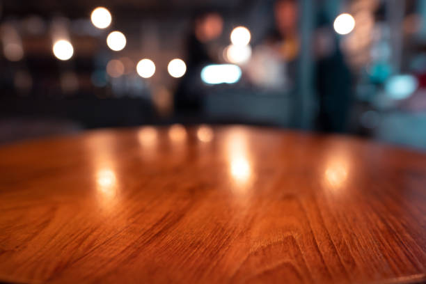 istock Mahogany wood table surface in warm luxury style cafe. 1419785864