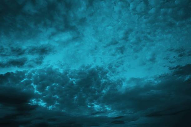 istock Black blue green night sky with clouds. Wind. Before the storm. Dramatic skies. Dark teal color background. 1419787274