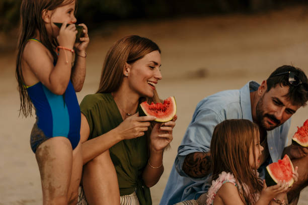 istock Family on beach picnic day 1419788479