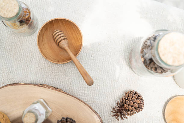 istock Honey dipper on the table covered with white cloth. Top view. Selective focus. 1419789535