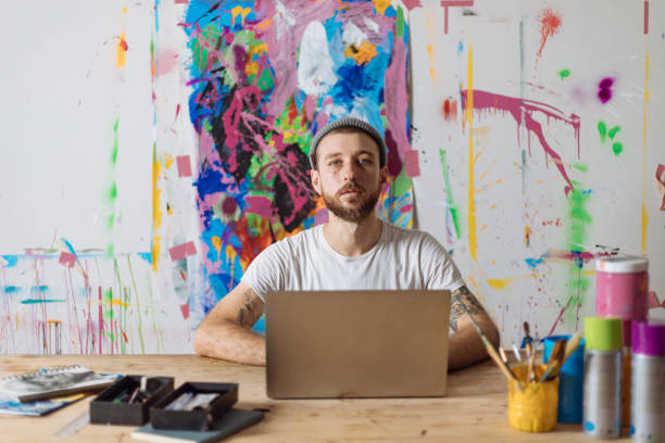 istock Young Man Works From His Messy Art Studio 1419791062