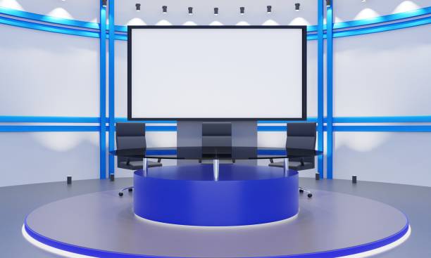 istock glass table on stand with led screen background in the red news studio room.3d rendering. 1419791824