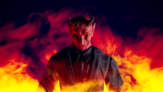 Red devil wearing black suit in flames. light from the side. Horror or devil businessman concept. 3D Render.