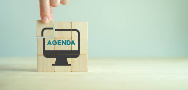 Agenda meeting appointment activity information concept. List of meeting activities in the order to be taken up, beginning with the call to order, ending with adjournment. Agenda word on wooden cubes. orden del día de la reunión del concepto de información de la actividad de citas. lista de las actividades de la reunión en el orden que se va a tomar, comenzando con la llamada al orden, terminando con el aplazamiento. palabra de agenda sobre cubos de