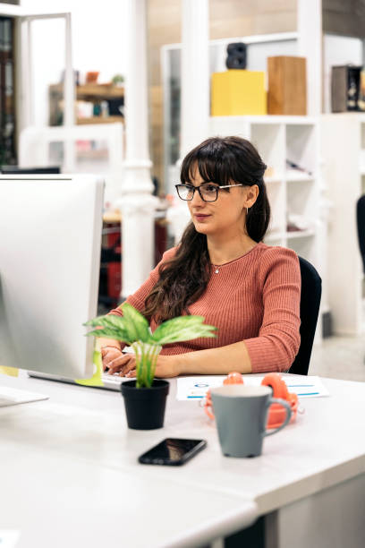 istock Pretty Woman Working in the Office 1419795360