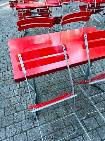 Red empty café chairs and table