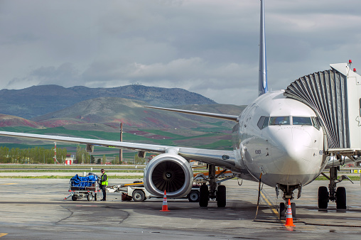 Ankara, Turkey - April 29, 2014 : AnadoluJet aircraft completes cargo loading preparations and other operations at Ankara Esenboğa Airport.