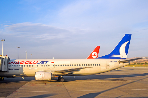 Antalya, Turkey - July 12, 2008 : Turkish Airlines and AnadoluJet planes waiting on the apron