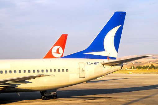 Antalya, Turkey - July 12, 2008 : Tail sections of aircraft belonging to Turkish Airlines and AnadoluJet
