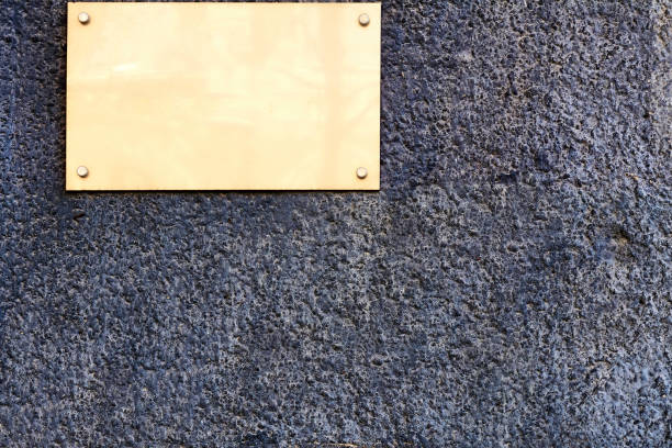 istock Plaque with place for text on granite blue brown wall 1419814978