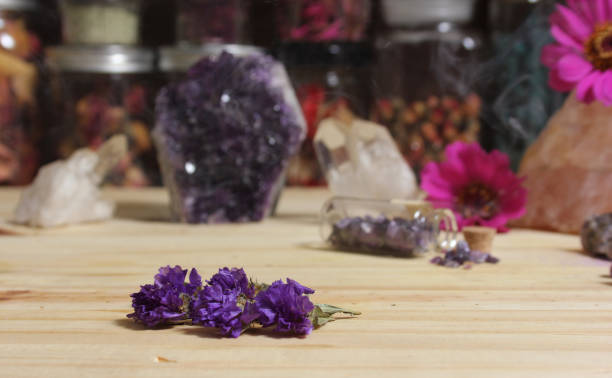 istock Amethyst Crystals With Flowers on Meditation Table 1419814985