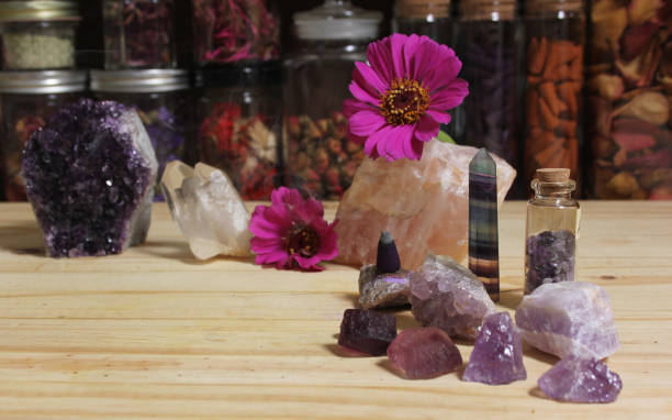 istock Amethyst Crystals With Flowers and Incense Cones on Meditation Table 1419815003
