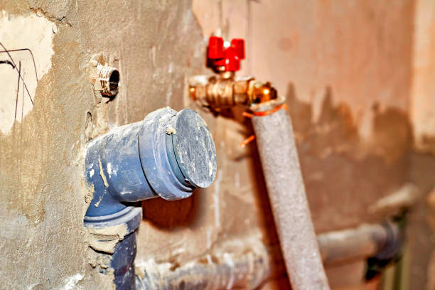 istock Hole with a pipe in the wall for connecting plumbing 1419815680