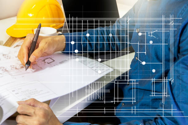 istock Engineers work on construction drawings and safety systems.,Building construction puts safety first. 1419820811