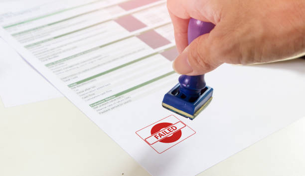 istock Businessman signing a business project rejection stamp,Failure to pass financial documents,Borrowing and Interest,financial lending 1419821748