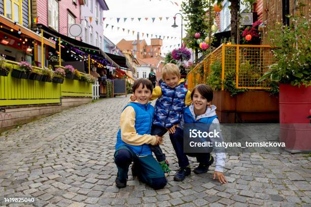Happy Family Children And Adults Enjoying The Colorful City Of Stavanger In Southwest Norway In Summer Stock Photo - Download Image Now