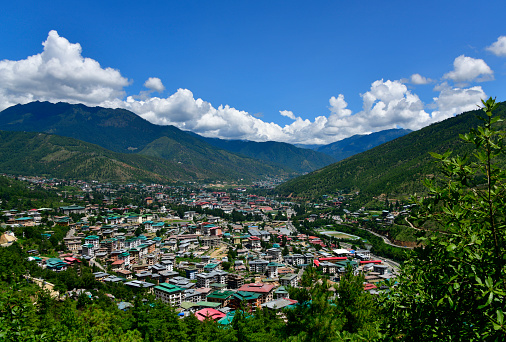 Thimphu, Bhutan: view over the city seen from the hills, valley along the Raidak River / Wang Chhu / Thimphu Chu - capital of the Himalayan kingdom of Bhutan, located at an altitude of 2320 - cityscape.
