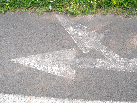 Painted arrows on the pavement.