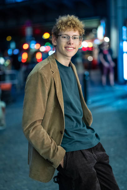 istock laughing young man in front of urban background 1419825976