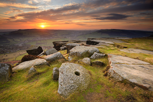 Wide angle view over Curbar Edge with iconic millstone in the Peak District National Park, Derbyshire, England, UK.