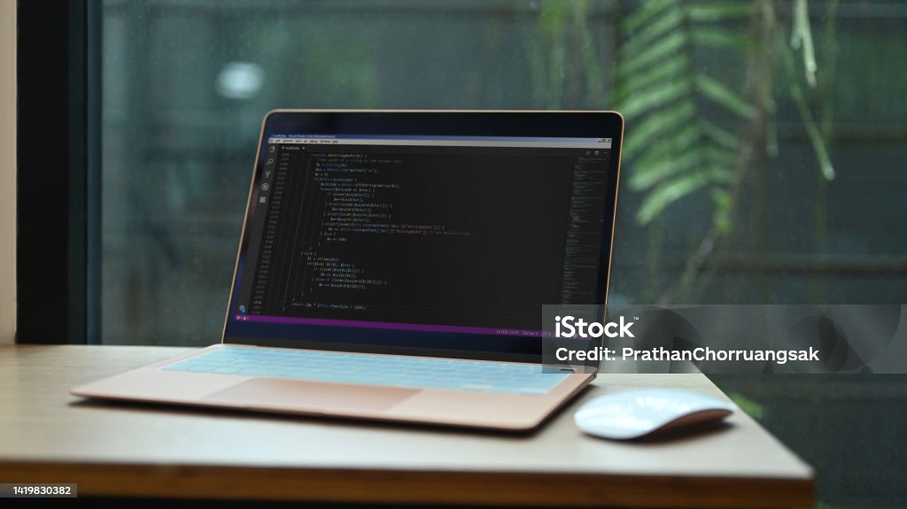 Laptop With Programming Code On Screens And Wireless Mouse Wooden ...